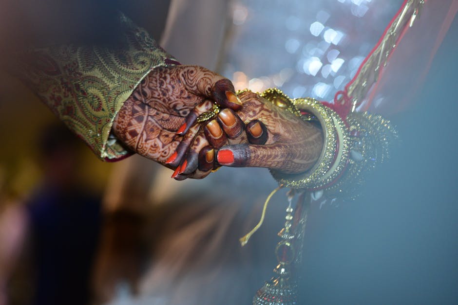pexels-photo-1444442-1444442 A beautiful capture of mehndi-decorated hands symbolizing love and tradition in a wedding ceremony.