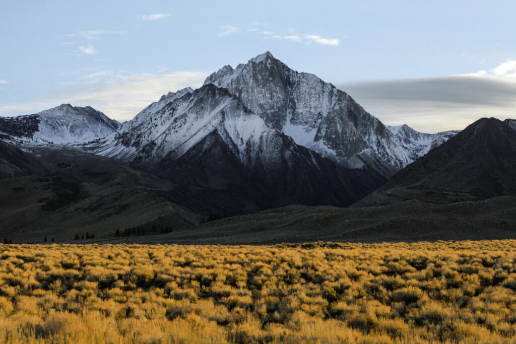 Snow-covered mountain range at daybreak